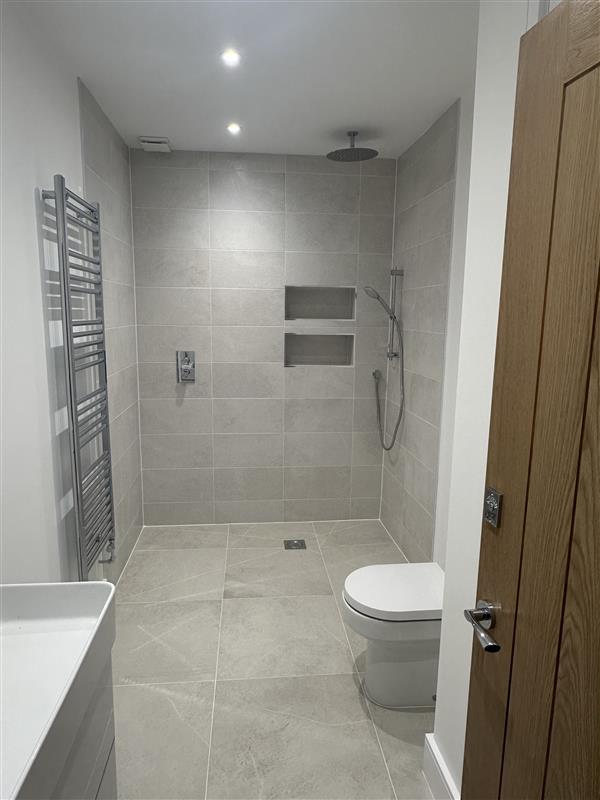 Tiled wet room with rainfall shower fitted by Hodges Building & Landscaping